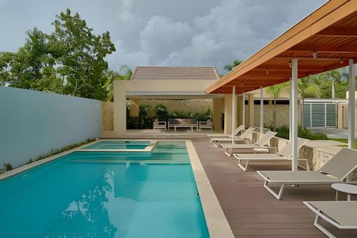 Swimming pool, Beachside 1BDR Dreamy Apt.| BBQ + Pool & Sea View in Juan Dolio Town Center