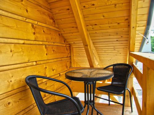 Balkons/terase, A wooden, eco-friendly house by the Goszcza lake Living room, 2 bedrooms in Mocki