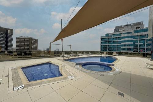 Swimming pool, Modern Studio in the Heart of Sports City in Dubai Sports City