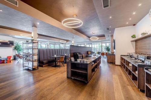 Restaurant, Hotel Aura Prague design and garden pool in Prague 09