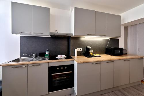 Cocina, Séjour tout confort en plein coeur de Nevers, studios Galet-Carbone ou Terra Cotta (Sejour tout confort en plein coeur de Nevers, studios Galet-Carbone ou Terra Cotta) in Nevers