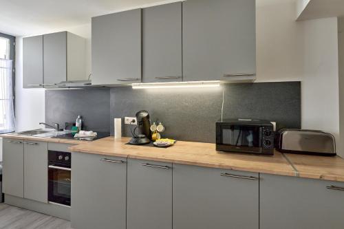 Cocina, Séjour tout confort en plein coeur de Nevers, studios Galet-Carbone ou Terra Cotta (Sejour tout confort en plein coeur de Nevers, studios Galet-Carbone ou Terra Cotta) in Nevers