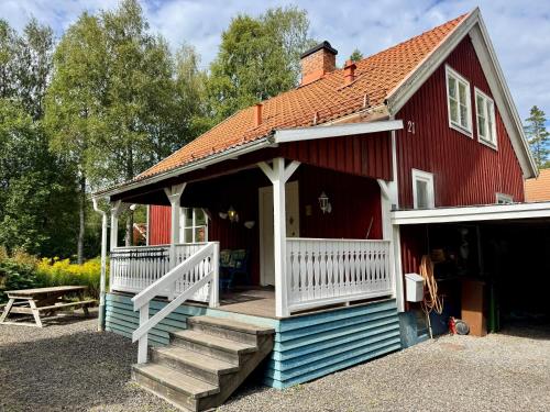 House near forest and water in Laggasen