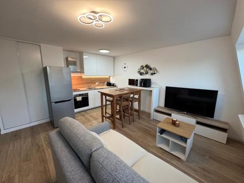 Общ салон/телевизионна зона, Le charme aux portes de Paris in Боньойл-сюр-Марн