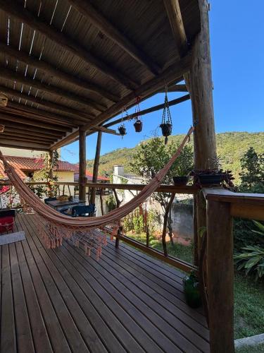 Quarto com banho privado e lavanderia in Joaquina Beach