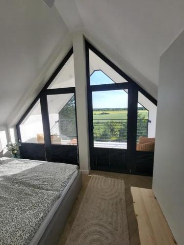 Dom nad jeziorem w Borzechowie - Po Horyzont in Bialachowo