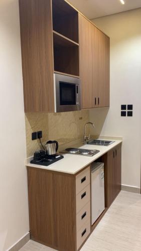 Kitchen, شقق نيفا المخدومة in Ha'il