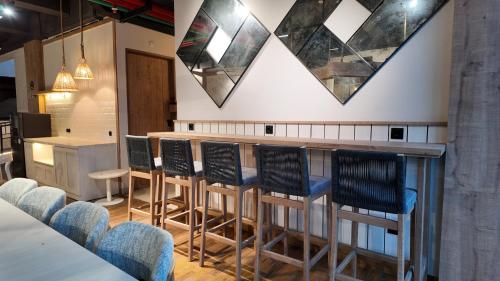 Shared lounge/TV area, Jambuluwuk Bromo Poshtel in Bromo