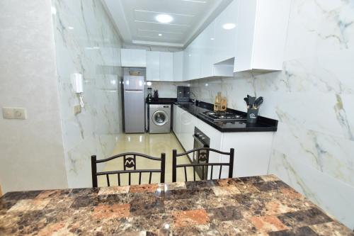 Kitchen, Agadir Vibes 3 appartements & 1 studio modernes au cœur de la ville in Najah