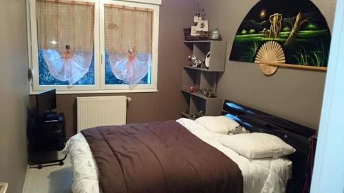 Appartement chaleureux in ลุกเซย-เล-แบ็ง