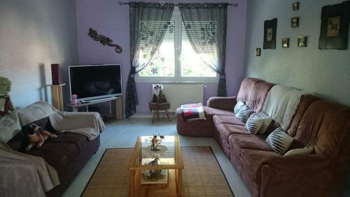 Appartement chaleureux in ลุกเซย-เล-แบ็ง