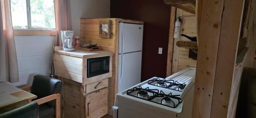 Suite with a King Bed and Full Kitchen at the Cedaredge Lodge in Cedaredge