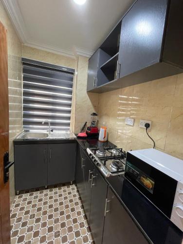 Kitchen, Cozy Court Apartment in Ifako Agege