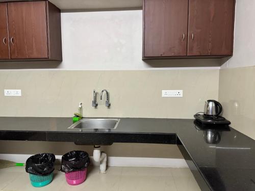 Kitchen, Nachiyar Suites in Thiruvananthapuram