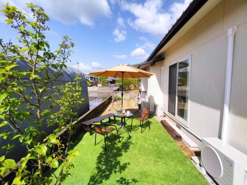 岡本Baseｰ1棟貸切ｰ最大9名ｰ4寝室-庭と星空ｰ和室ありｰ駐車場