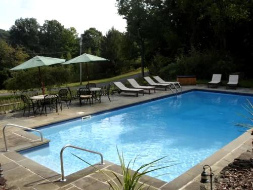 Secluded Cottage Rental with a Heated Pool in Red Hook for Family Getaways in New York State in Pine Plains