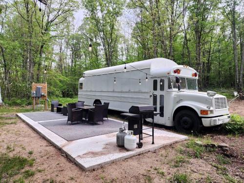 Rustic Converted School Bus with Outdoor Shower Near ORV Trails in Manistee National Forest, Michigan, Bitely