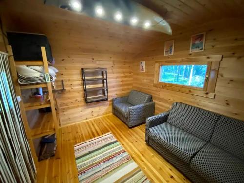 Off-Grid Waterfront Cabin Ideal for Nature and Adventure Lovers in Finland in Pohjaslahti