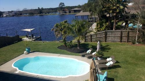 Beautiful Waterfront Cottage Rental with a Pool near New Orleans, Louisiana in Slidell