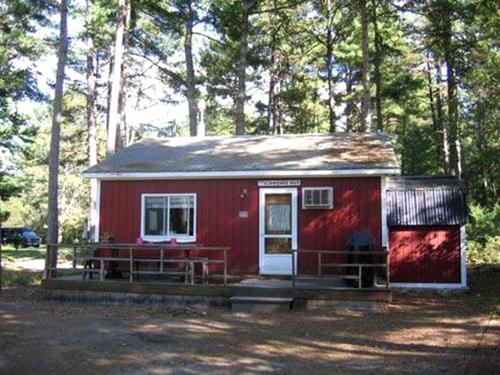 Dog-Friendly Lakeside Cabin Rental with Private Beach in Brownfield, Maine · Cornish