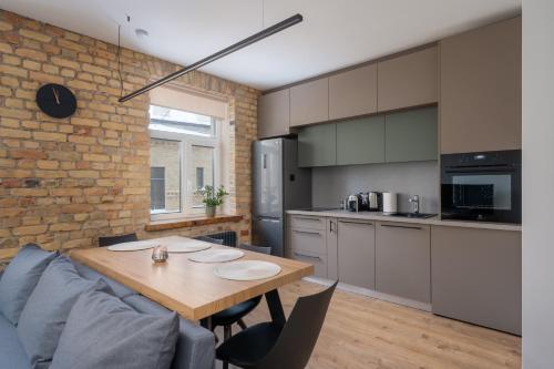 Apartment with Exposed Brick Interior - Stabu Street, Riga