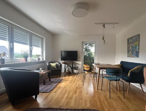 Shared lounge/TV area, Ferienwohnung Bucherkiste in Hetzerath