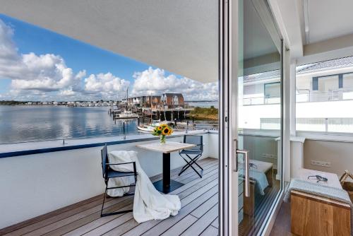 Balkon/Terrasse, Harbour Lodge: Meerblick, Terrasse, Balkon, finnische Sauna, Kaminofen in Olpenitz