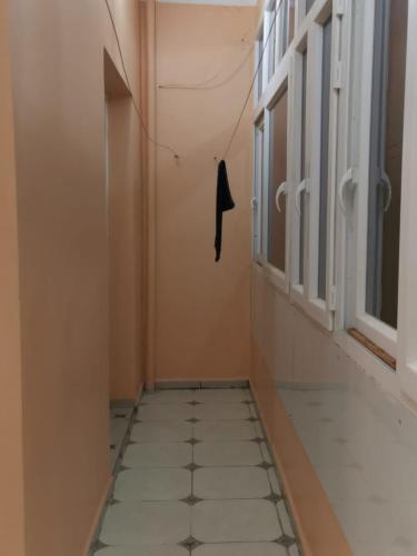 Appt F4 equipé au rez de chaussé d'un immeuble privé