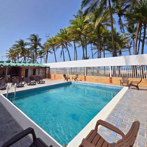 Swimming pool, Tucacas, Frente al Mar, Vista a la Piscina y Playa Privada in Boca de Aroa