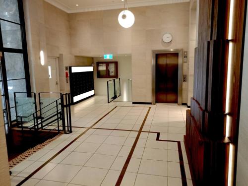 Unwind in Style at Melbournes Historic Art Deco Apartment with Pool Gym Carpark