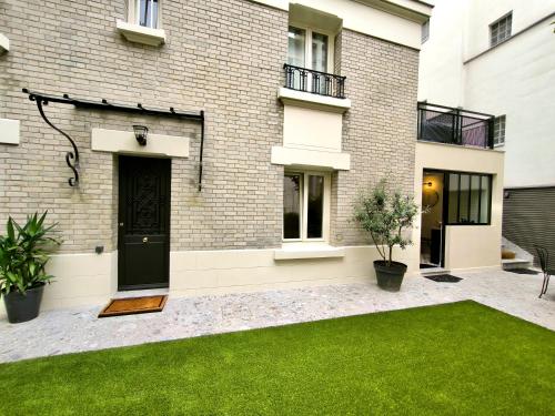 Montmartre en rez-de-jardin, Paris (photo 2)