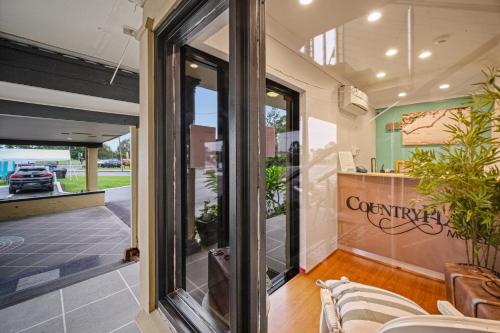 Jardín, Country Plaza Motel Taree in Taree