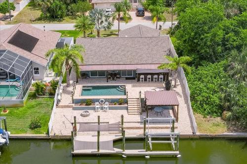 Waterfront Retreat with Pool Tiki Bar & Boat Dock