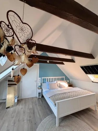 Lüttje Koje - Ferienhaus direkt am Deich und dem Meer dahinter in Norden, Deutschland