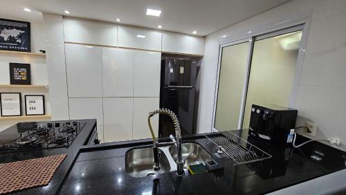 Deck com churrasqueira privativa - Piscina - Praia das Pitangueiras in Barra Funda