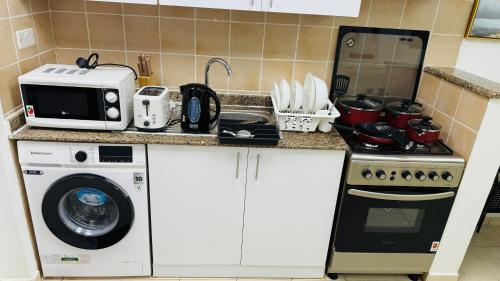 Facilities, X11 Furnished with balcony England cluster international city near Dragon Mart in Dubai International City