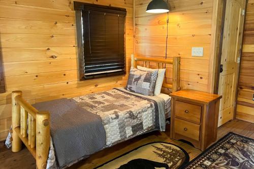 Knotty Creek Retreat Creek access firepit hot tub wood-burning fireplace in Morganton, USA