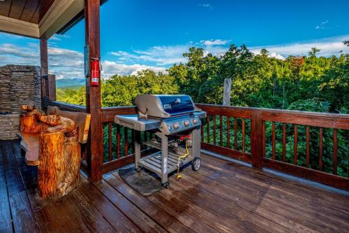 Moonstruck - Stone Firepit with a Waterfall Outdoor Hot Tub Game Room + Chalet Village Access - image 10