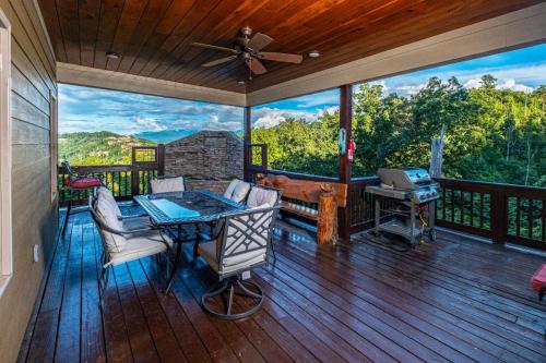 Moonstruck - Stone Firepit with a Waterfall Outdoor Hot Tub Game Room + Chalet Village Access - image 3