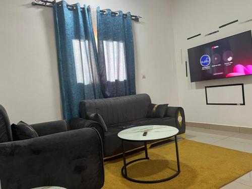 gedeelde lounge/tv-ruimte, Residence Alasr in Bamako