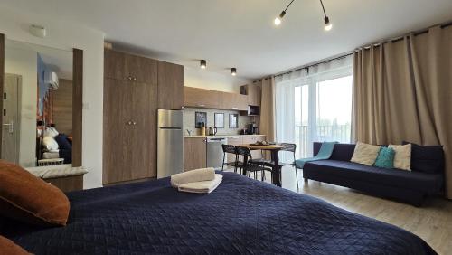 Q Apart Meta - klimatyzowane apartamenty przy Manufakturze z garażem lub parkingiem Gratis, FV – khách sạn tại Baluty