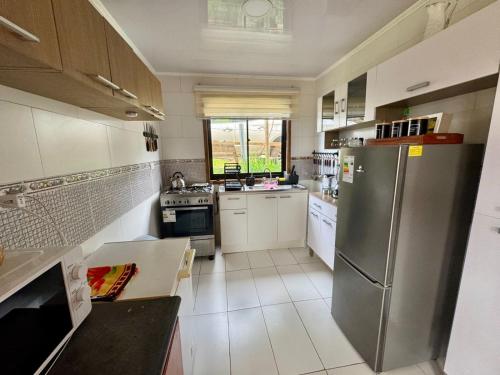 Casa con vista al rio Cutipay in Cutipai