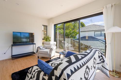 Modern 4-Bedroom Home in Glenfield, Auckland (foto 2)