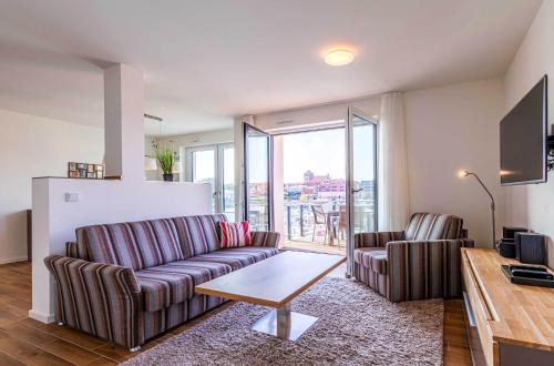Sieglinde - Apartment in der Hafenresidenz mit Balkon & Wellness