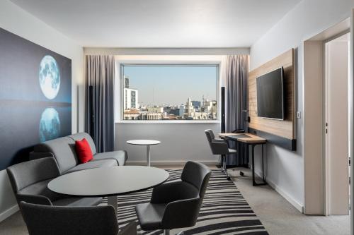 Junior Suite with a double bed and sofa