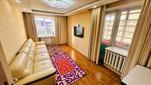 gedeelde lounge/tv-ruimte, Cozy apartment in downtown Ulgii in Olgii