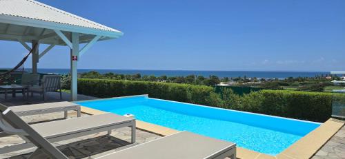 Les villas "Fenêtres Sur Plage" - Villas Créoles de charme , vue exceptionnelle face mer et plage & piscines privées à débordement