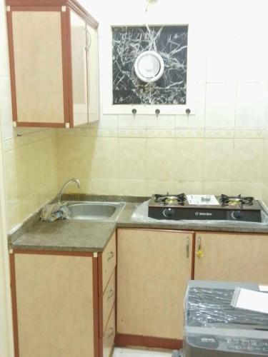 Kitchen, استوديوهات وغرف in Ras Al Khaimah