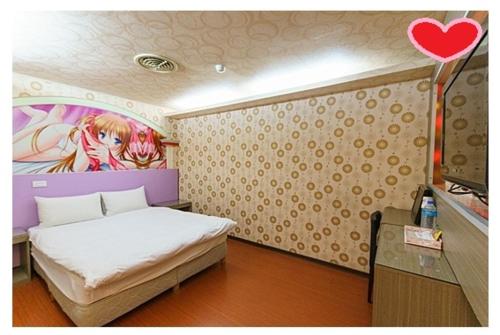 a room with a bed, a chair, and a lamp, Happy Holiday Hotel in Taoyuan