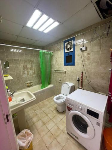 Room attached bathroom with tv in Madinat Zayid